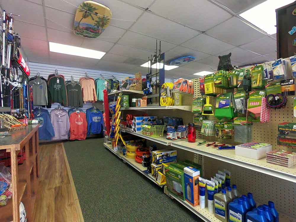 Store interior with fishing gear, clothing, and boating supplies on shelves.